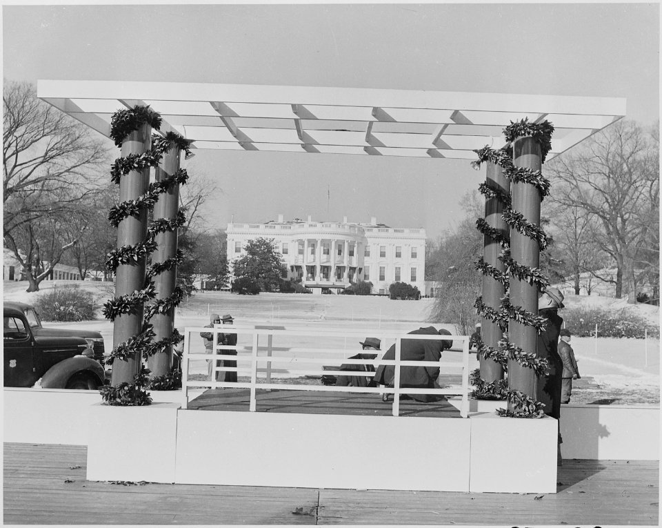 Photograph of workmen preparing the speaker's platform for the ceremonial lighting of the National Community... - NARA - 199277