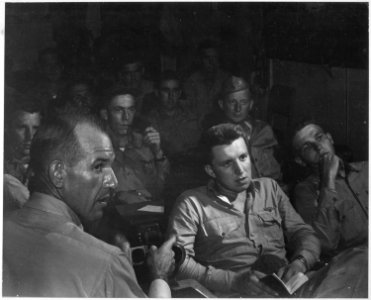 Pilots being briefed on board USS ESSEX the night before they were to raid Formosa. - NARA - 520855