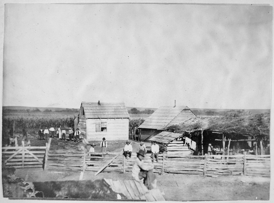 Pisehedwin, a Potawatomi, and others in front of his Kansas farm home, 1877 - NARA - 519145