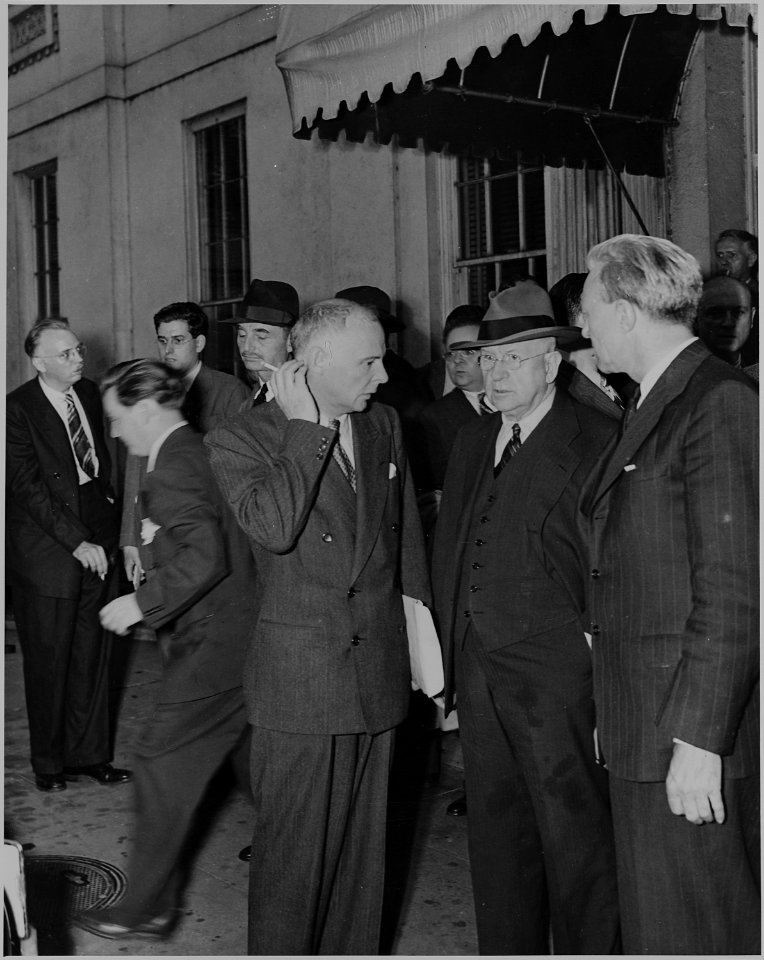 Photograph of unidentified persons outside the White House shortly after the death of President Roosevelt. - NARA - 199063