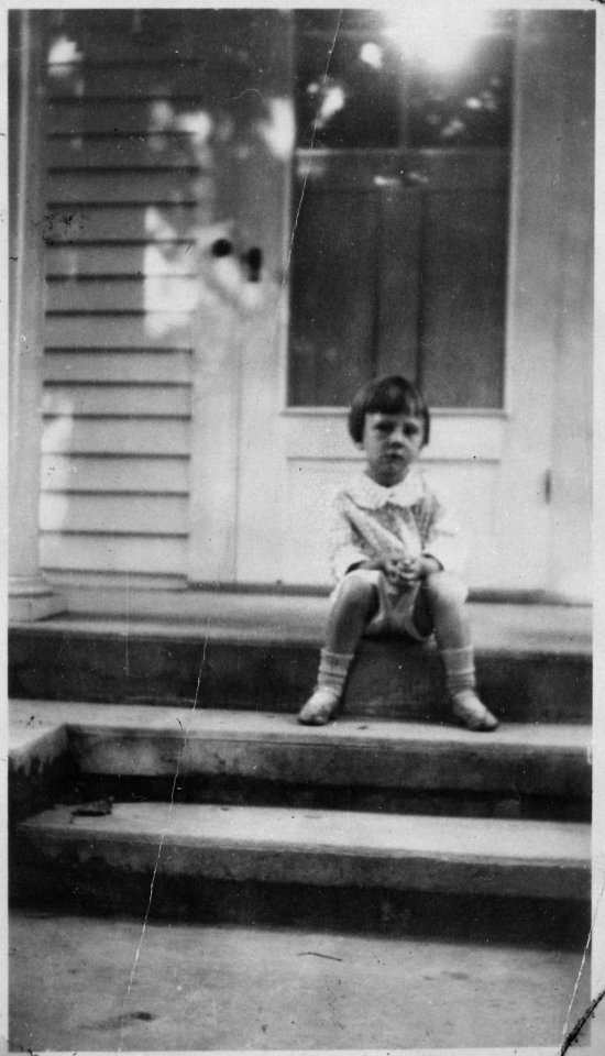 Photograph of Thomas G. Tom Ford, Half-Brother of Gerald R. Ford, Sitting on the Front Steps of an Unidentified House - NARA - 186938 photo
