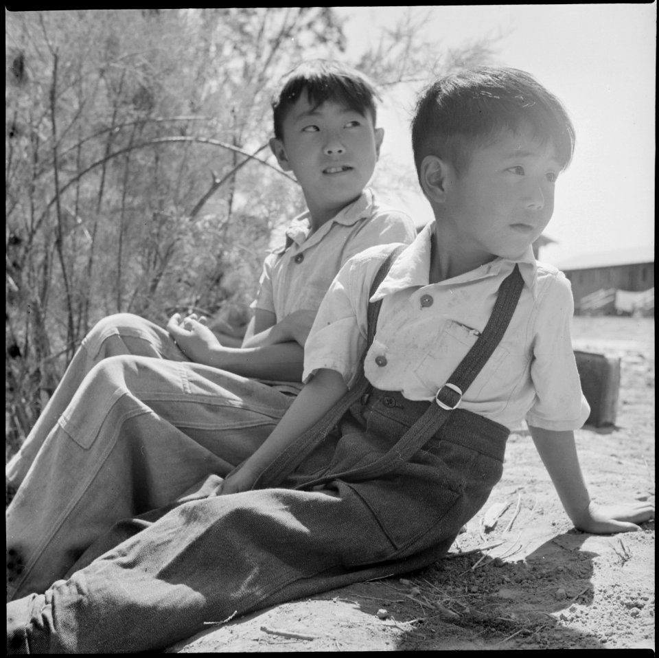 Poston, Arizona. Boys of Japanese ancestry fishing for carp in the canal on northwest side of this . . . - NARA - 538569
