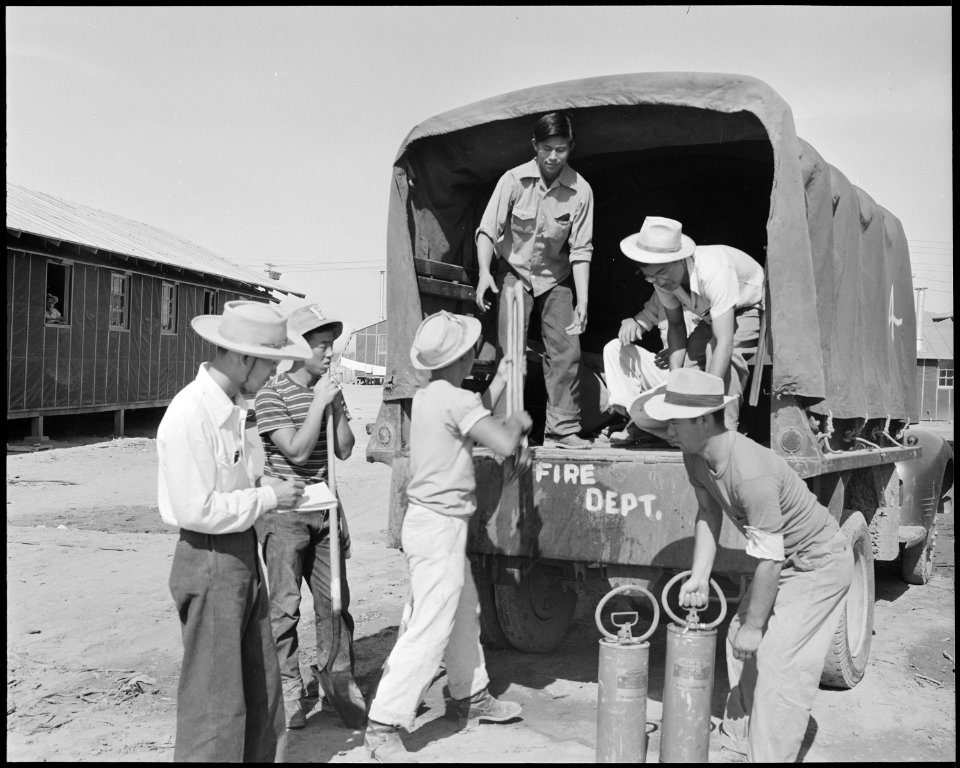 Poston, Arizona. Evacuees fire truck crew prepare for eventualities at this War Relocation Authorit . . . - NARA - 536095