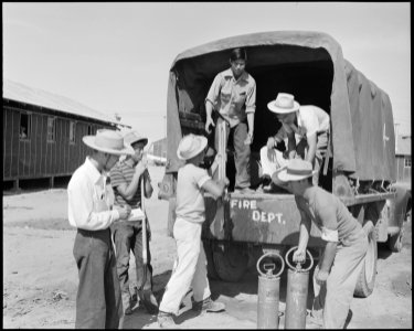 Poston, Arizona. Evacuees fire truck crew prepare for eventualities at this War Relocation Authorit . . . - NARA - 536095