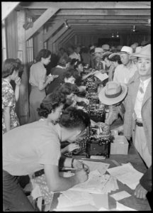 Poston, Arizona. Evacuees of Japanese ancestry are being registered upon first arrival at this War . . . - NARA - 536139 photo