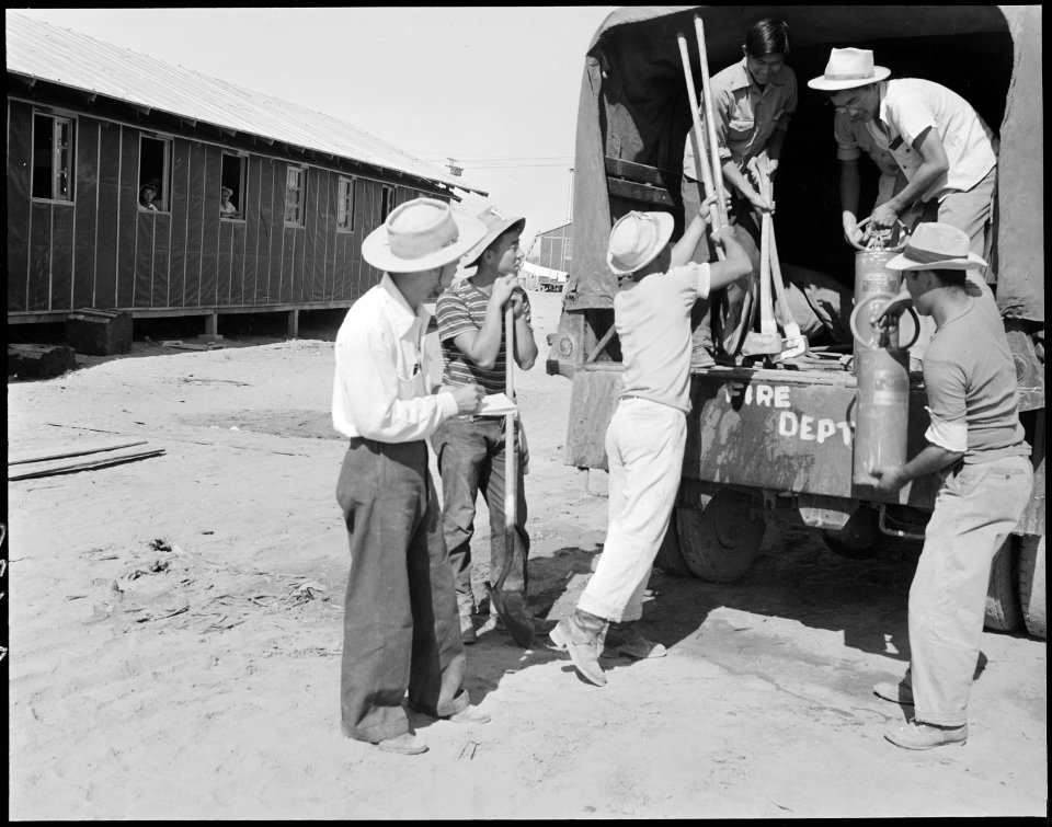 Poston, Arizona. Evacuee fire truck crew members prepare for eventualities at this War Relocation A . . . - NARA - 536096