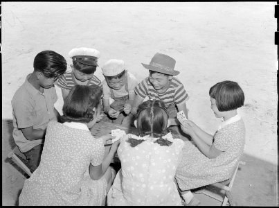 Poston, Arizona. Group of evacuee children enjoying game of Black Jack at this War Relocation Autho . . . - NARA - 538527