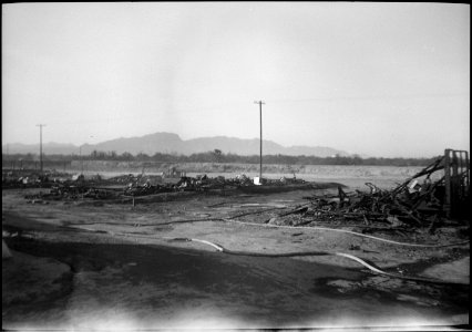 Poston, Arizona. Fire hose was kept available and in action for hours following the fire. Wind ble . . . - NARA - 539521