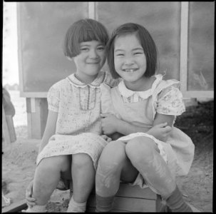 Poston, Arizona. Little girls playing house at this War Relocation Authority center where evacuees . . . - NARA - 538552