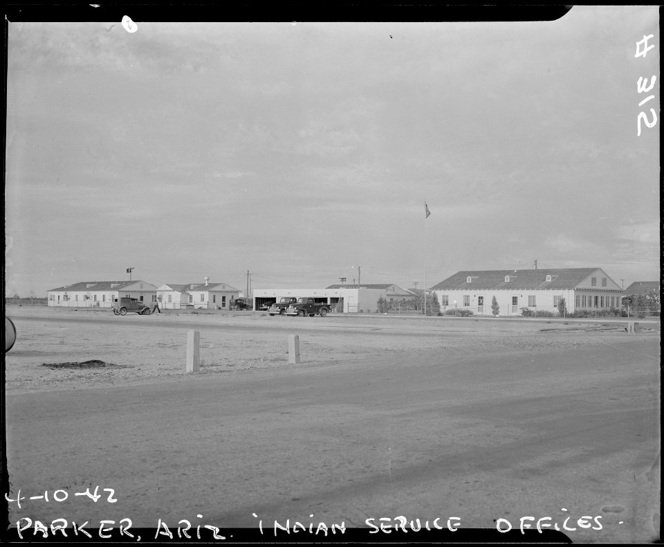 Poston, Arizona. Indian Service offices surrounded by lawn and greenery amid the desert, on the Col . . . - NARA - 536253