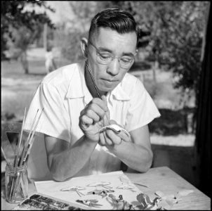 Poston, Arizona. Mr. Hitomi and some of the skilled wood carvings and paintings that he has done wh . . . - NARA - 539887