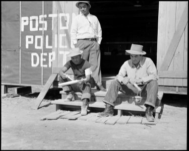 Poston, Arizona. Members of the police department carving clubs at this War Relocation Authority ce . . . - NARA - 536098
