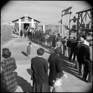 Poston, Arizona. New Years Fair. Crowds entering educational exhibit. - NARA - 536613