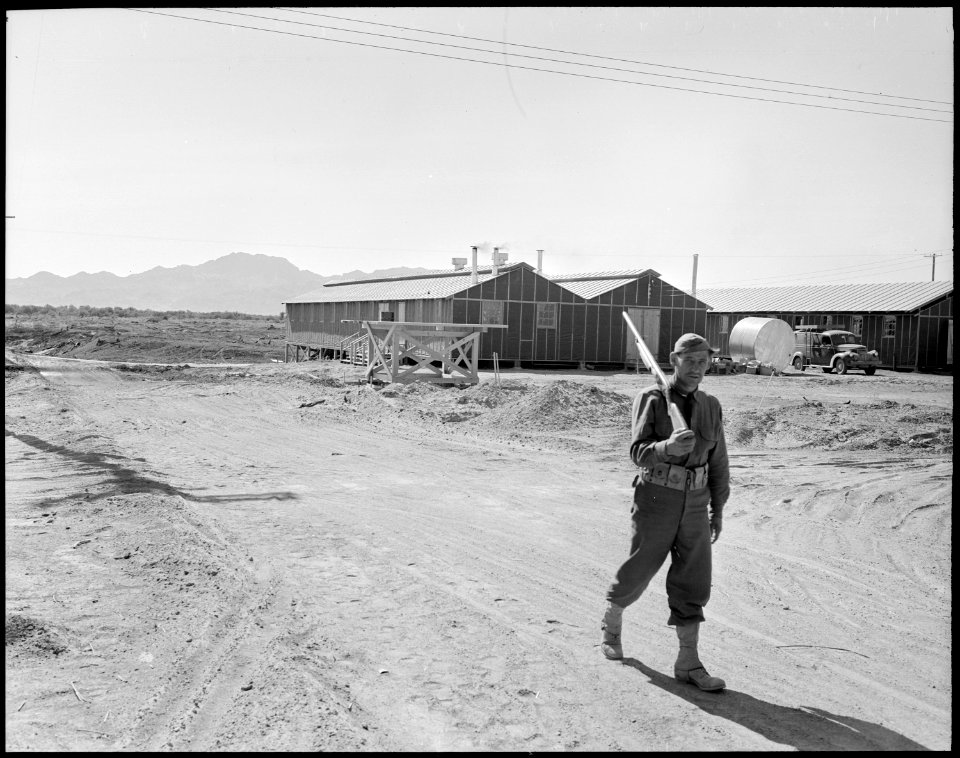 Poston, Arizona. Military sentry keeping civilians away from mess hall at Poston 1. - NARA - 536072 photo