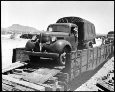 Poston, Arizona. Most of the building is being done by old Civilian Conservation Corps trucks at th . . . - NARA - 536116 photo