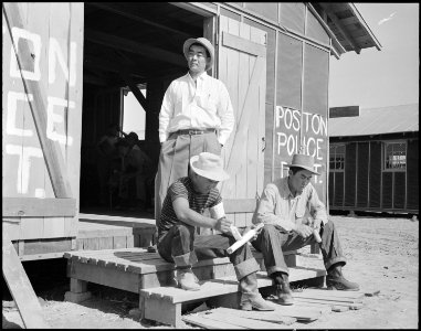 Poston, Arizona. Members of the police department carving clubs at this War Relocation Authority cen . . . - NARA - 536099