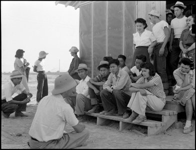 Poston, Arizona. Norris James, War Relocation Authority representative gives instructions and assig . . . - NARA - 538528