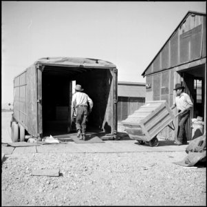 Poston, Arizona. Moving freight directly from Poston to future homes back in California. These box . . . - NARA - 539860 photo