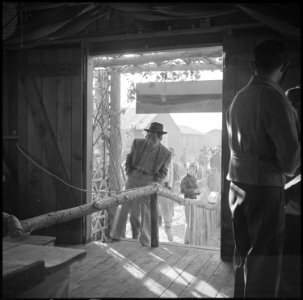 Poston, Arizona. New Years Fair. Crowds entering the agricultural exhibit. - NARA - 536615