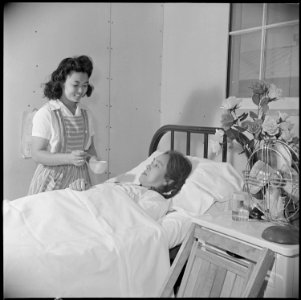 Poston, Arizona. nurse's aid student, Cheiko Neeno, attends Mrs. Hide Uyeda, a patient in the Posto . . . - NARA - 537107
