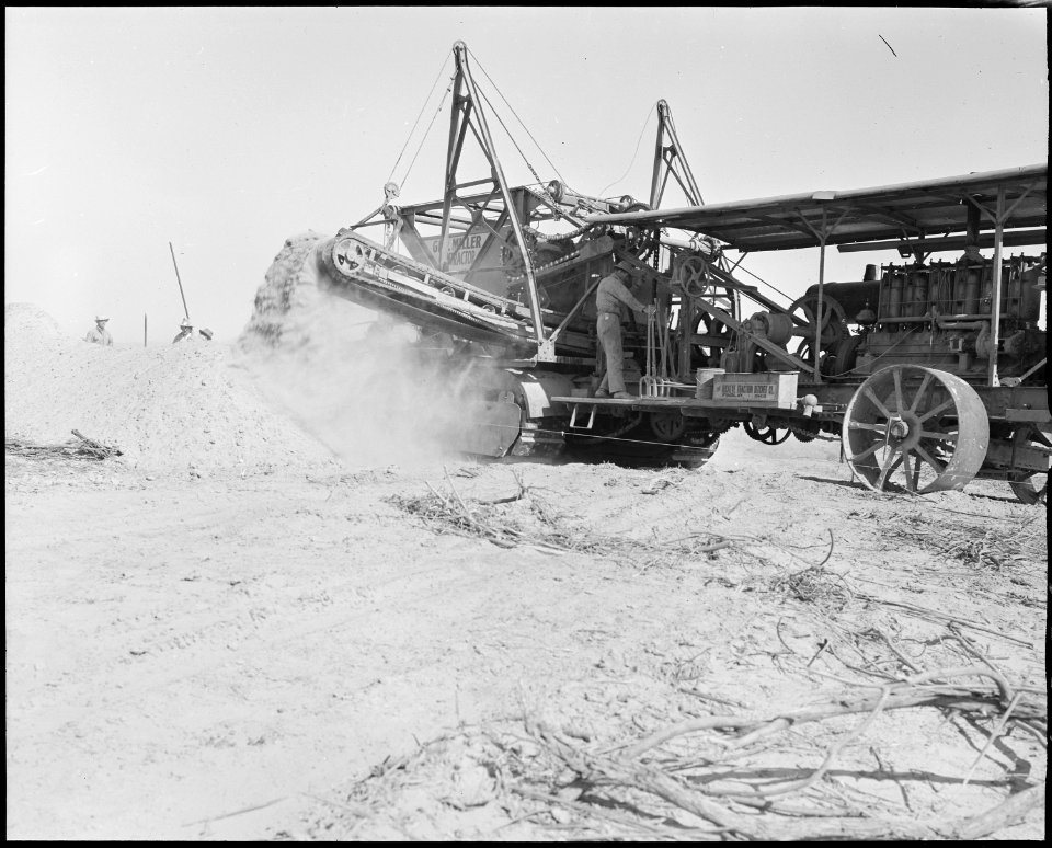 Poston, Arizona. Sewer trench being dug by ditch digger at this War Relocation Authority center for . . . - NARA - 536308