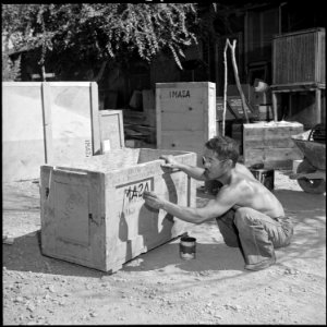 Poston, Arizona. One of the last residents to leave Camp III, Mr. H. Asami labels his boxes prepara . . . - NARA - 539865