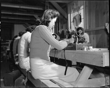 Poston, Arizona. Sewing school. Evacuee students are taught here not only to design but make cloth . . . - NARA - 536651 photo
