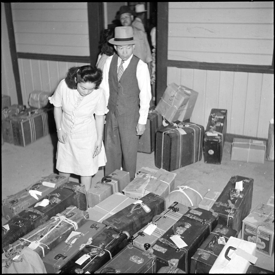 Poston, Arizona. On arriving in Parker there is the anxious perusal of the baggage in order to clai . . . - NARA - 539872