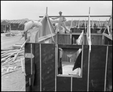Poston, Arizona. Barracks under construction at this War Relocation Authority center where evacuees . . . - NARA - 536298 photo