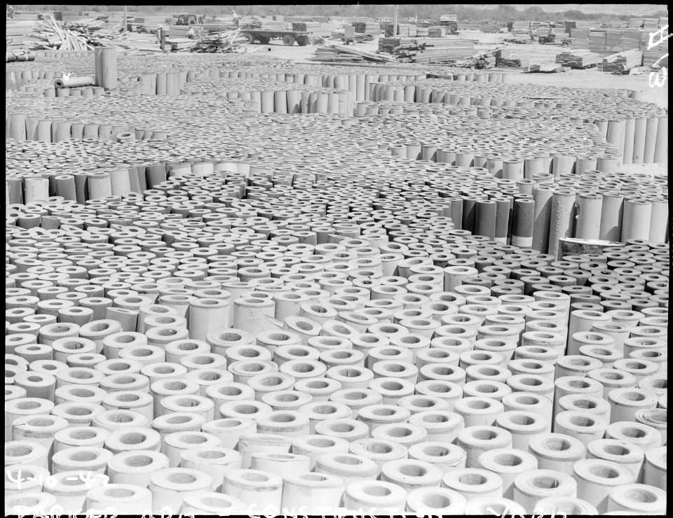 Poston, Arizona. Rolls of roofing used in the construction of the War Relocation Authority center l . . . - NARA - 536009