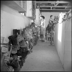 Poston, Arizona. Shoe Repair shop at Camp Number 1. The shoes on the left were received on a singl . . . - NARA - 536631