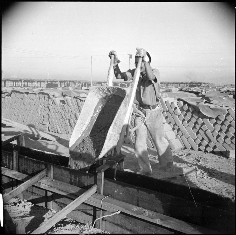 Poston, Arizona. School buildings are being erected by evacuee labor. The structure will be of ado . . . - NARA - 536619
