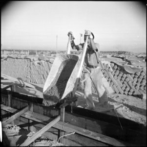 Poston, Arizona. School buildings are being erected by evacuee labor. The structure will be of ado . . . - NARA - 536619