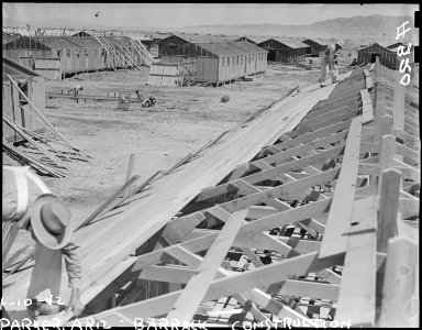 Poston, Arizona. Constructing quarters for evacuees of Japanese ancestry at War Relocation Authorit . . . - NARA - 536258 photo