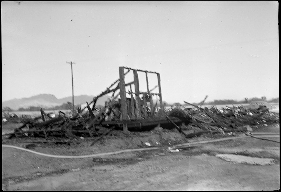 Poston, Arizona. Shown here are the remains of the six barracks after the fire on Christmas night, . . . - NARA - 539523