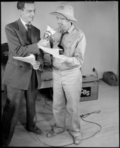 Poston, Arizona. The contractor's Superintendant, Newell, with CBS Announcer, Chet Huntley at the m . . . - NARA - 536283