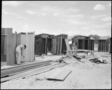 Poston, Arizona. These little buildings are for the use of construction employees. - NARA - 536317 photo