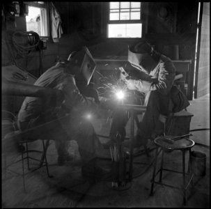 Poston, Arizona. Welders in the machine shop at this War Relocation Authority center. They are lef . . . - NARA - 537117