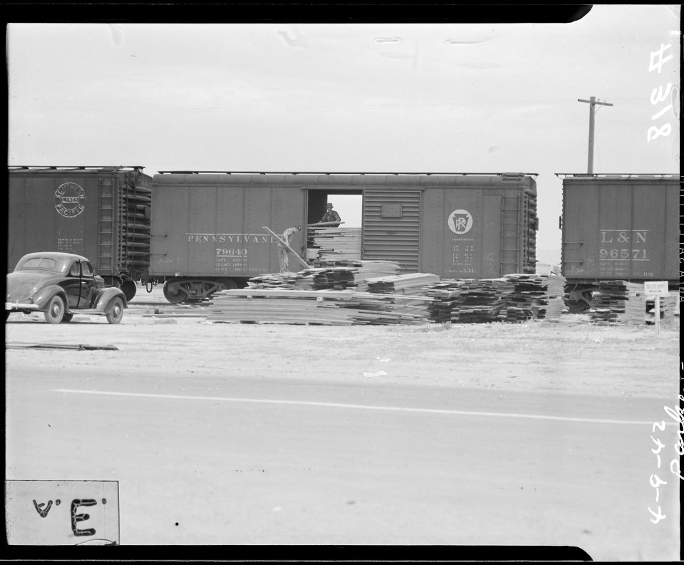 Poston, Arizona. Unloading lumber for construction of War Relocation Authority center for evacuees o . . . - NARA - 536256