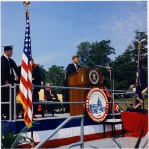 President addresses American University Commencement, receives honorary degree. President Kennedy at Podium... - NARA - 194263 photo
