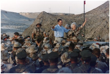 President and Mrs. Bush greet the troops of the First Division Marine Command Post during their visit to Saudi Arabia... - NARA - 186425