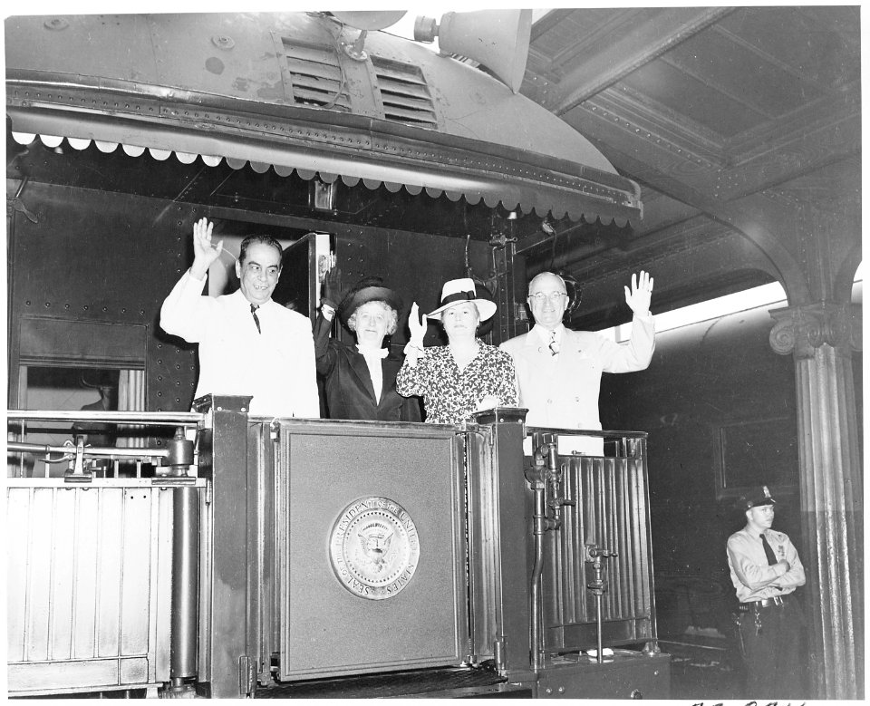 President and Mrs. Harry S. Truman and President and Mrs. Romulo Gallegos of Venezuela, standing on the rear platform... - NARA - 199874