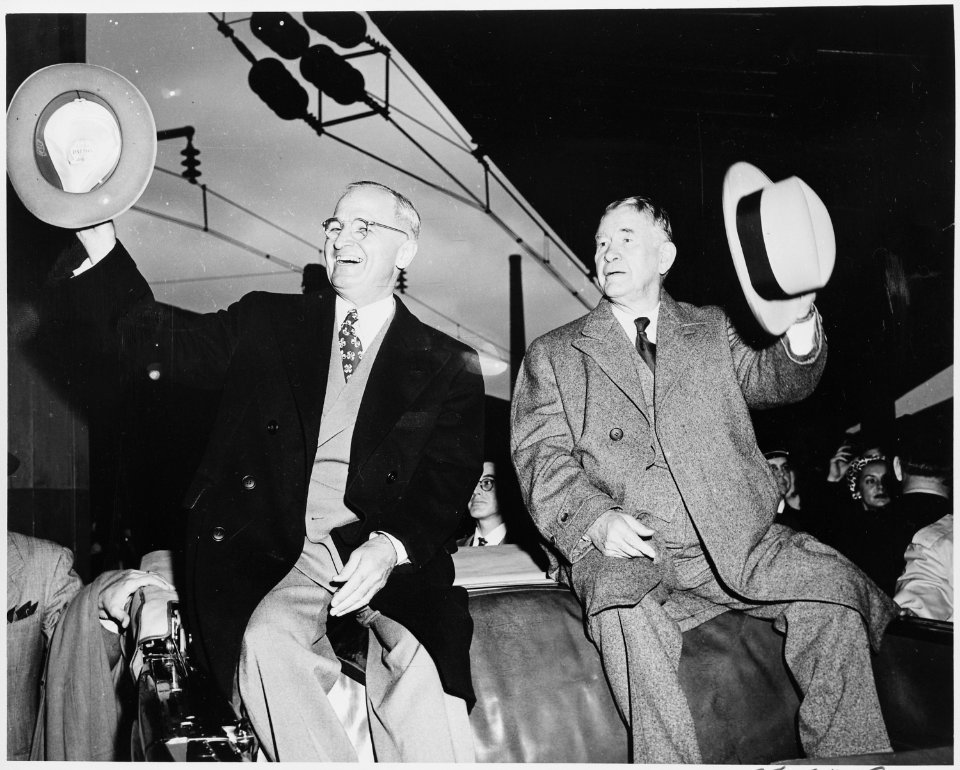 Presdient Harry S. Truman and Vice President-elect Alben W. Barkley in the Washington, DC train station, sitting on... - NARA - 199937