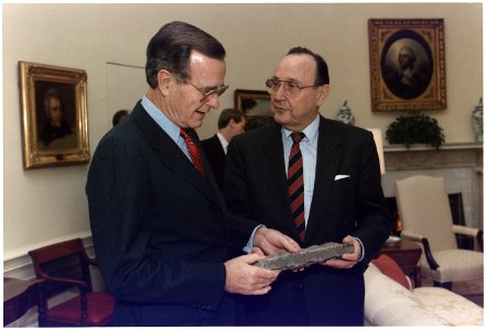 President Bush is presented with a piece of the Berlin Wall by West German Foreign Minister Hans-Dietrich Genscher in... - NARA - 186404