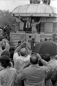 President and Mrs. Ford wave during their primary campaign in Michigan - NARA - 7027911
