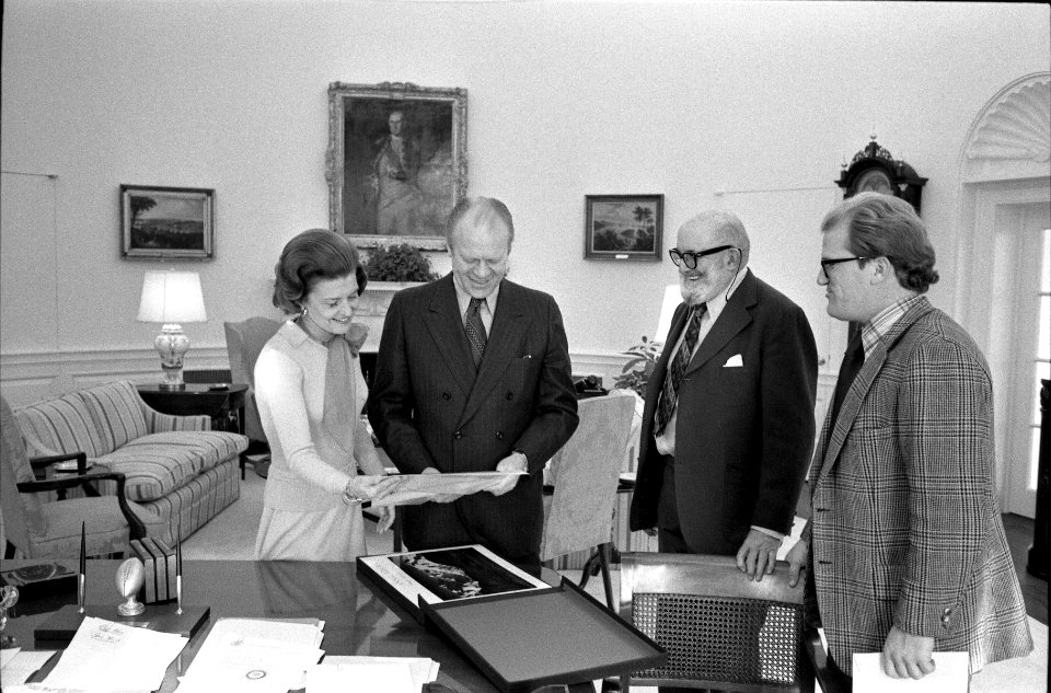 President Gerald R. Ford and First Lady Betty Ford Looking at Photographs in the Oval Office with Ansel Adams and William Turnage - NARA 27575790