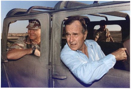 President Bush rides in a HUMVEE with General H. Norman Schwarzkopf during his visit with troops in Saudi Arabia on... - NARA - 186424