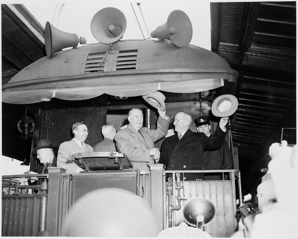 President Harry S. Truman and Vice President-elect Alben W. Barkley standing on the rear platform of the presidential... - NARA - 199935
