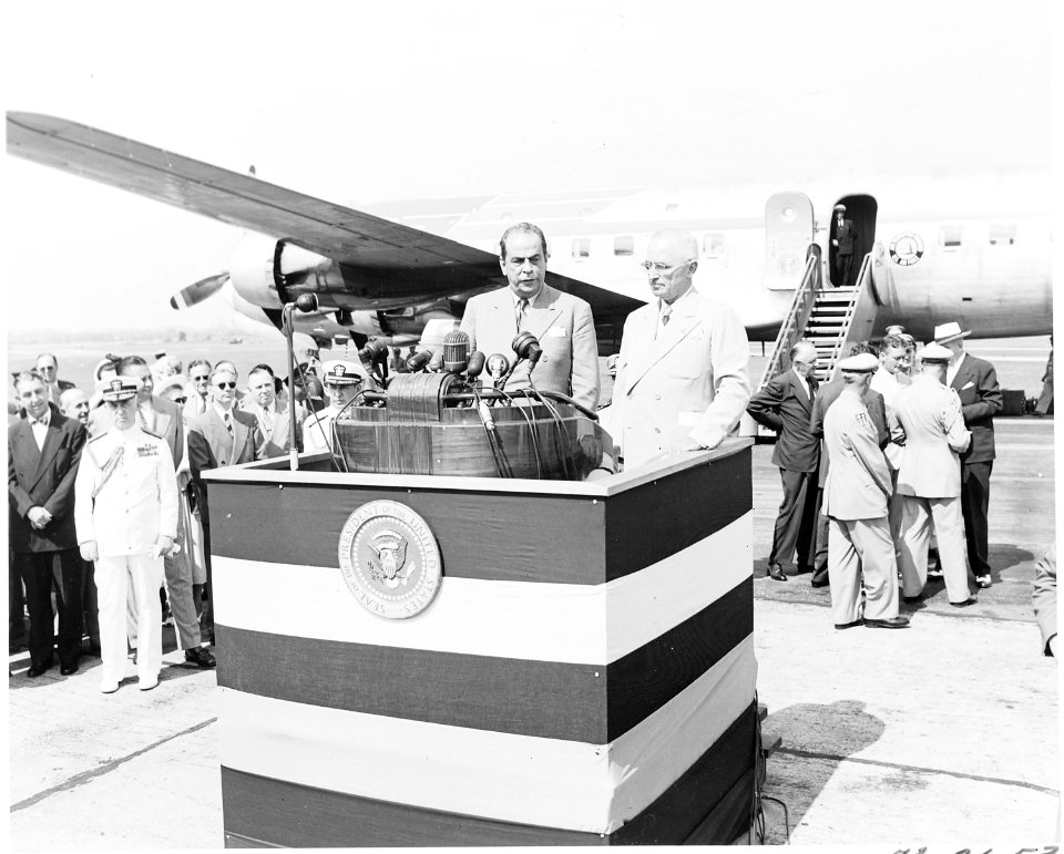 President Gallegos of Venezuela and President Truman at podium at airport where President Gallegos has just arrived... - NARA - 199811