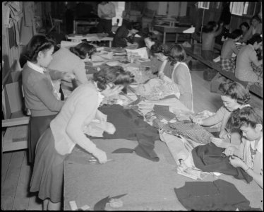 Poston, Arizona. Sewing School. Evacuee students are taught here not only to design but make cloth . . . - NARA - 536648 photo